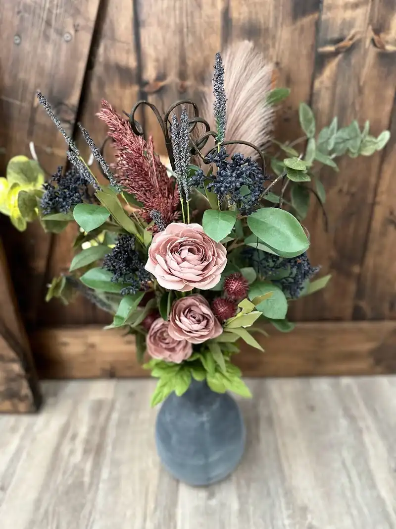 Custom order of mauve roses, pampas and berries in a slate blue vase